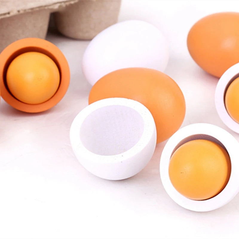 Wooden play egg set featuring brown and white eggs, some split open to reveal yolk interiors, designed for children's pretend play and kitchen activities.