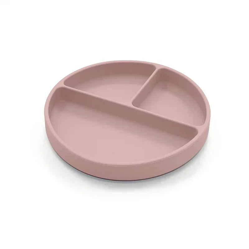 Dusty rose-colored silicone divided plate with three compartments, designed for toddler meals, portion control, and easy cleaning, ideal for baby-led weaning and independent eating.