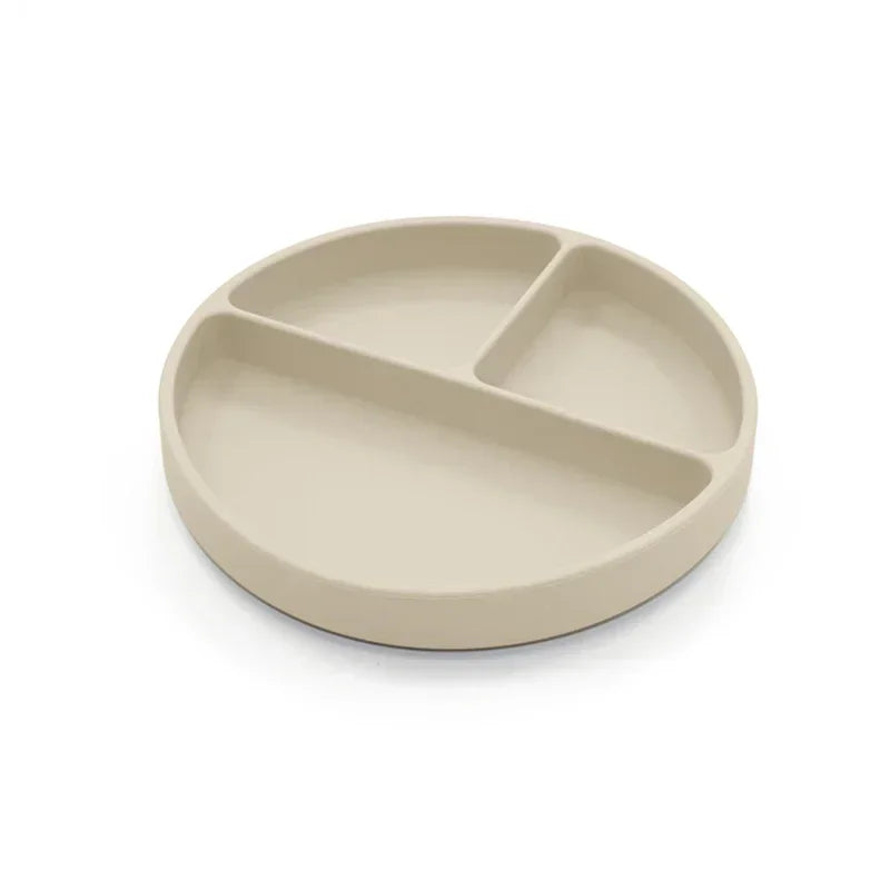 Ivory-colored silicone divided plate with three compartments, designed for toddler meals, portion control, and easy cleaning, perfect for baby-led weaning and independent eating.