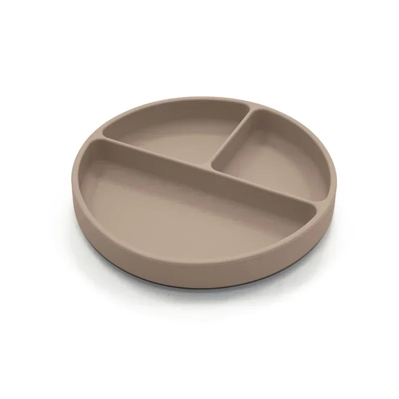 Taupe-colored silicone divided plate with three compartments, designed for toddler meals, portion control, and easy cleaning, ideal for baby-led weaning and independent eating.